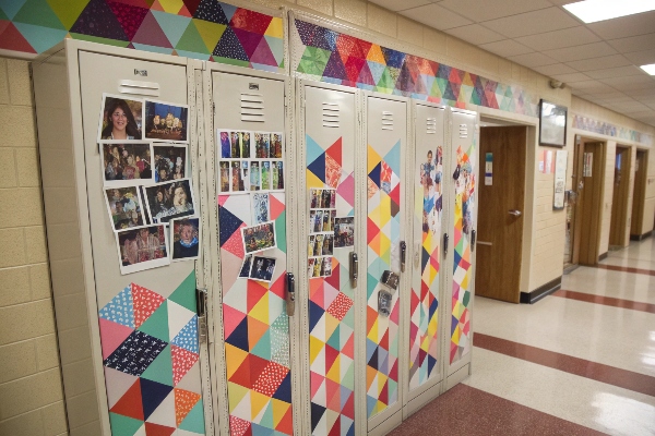 Colorful school lockers decorated with photos and patterns.