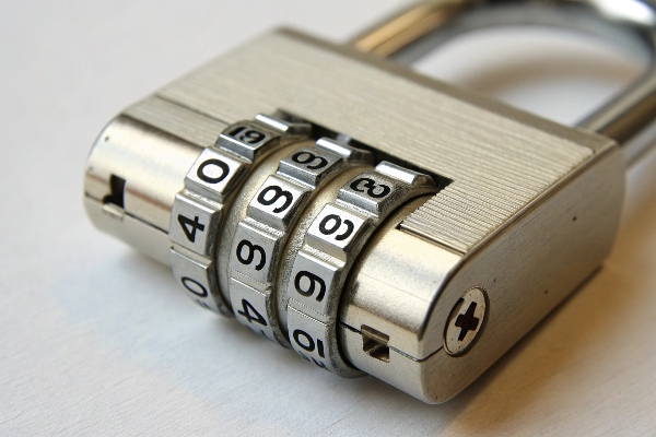 Close-up of a silver combination padlock with numbered dials.