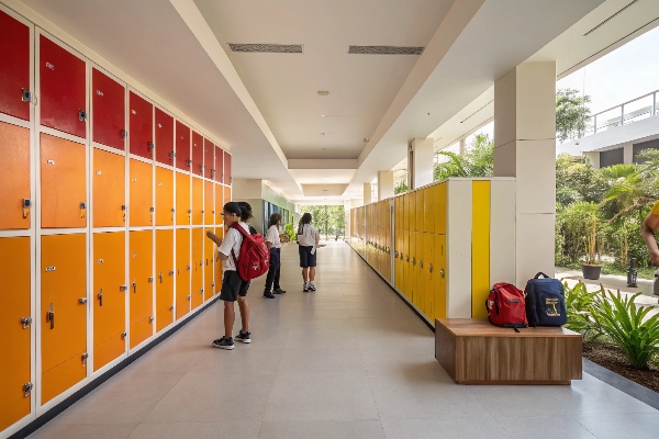 School hallway with colorful lockers.