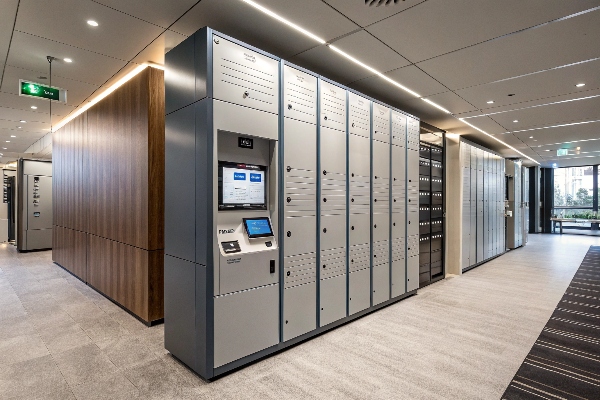 Advanced smart lockers with digital screens in a sleek office setting, perfect for secure storage