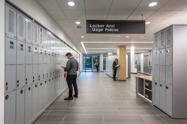 Spacious locker area with modern gray lockers, designed for professional environments