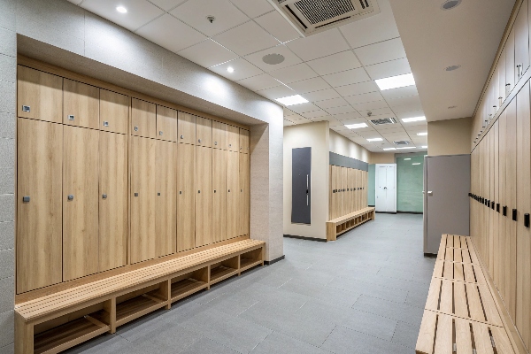 Modern locker room with wooden lockers and built-in benches