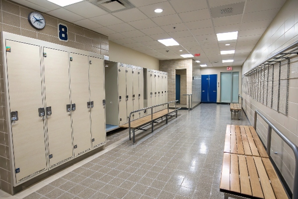 Locker room with beige lockers and benches