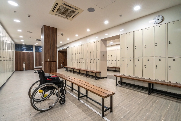 Locker room with open lockers and wooden seating