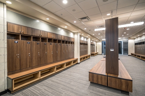 Locker room with wooden lockers and central seating