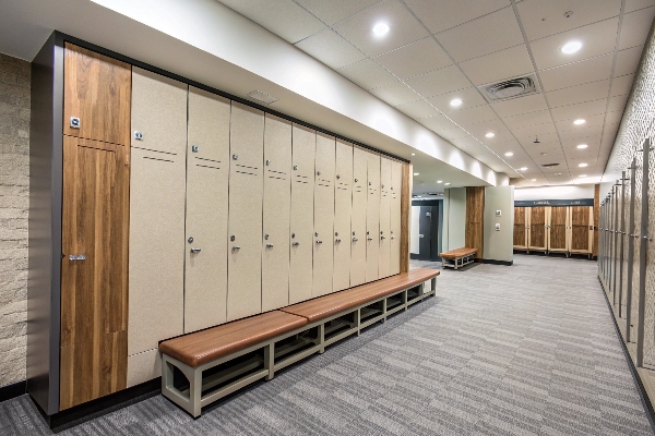 Locker room with beige lockers and leather benches