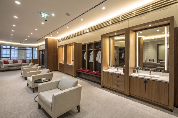 Luxurious locker room with seating and mirrors