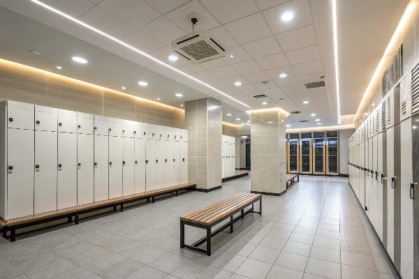 Locker room with white lockers and benches