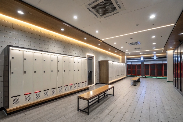 Locker room with white lockers and wood accents