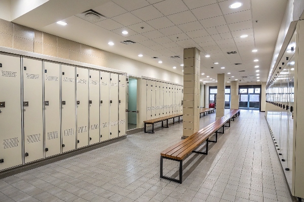 Locker room with beige lockers and benches