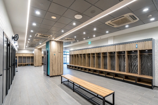 Locker room with wooden lockers and benches