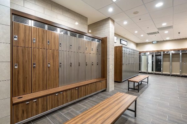 Locker room with wooden and metal lockers and benches