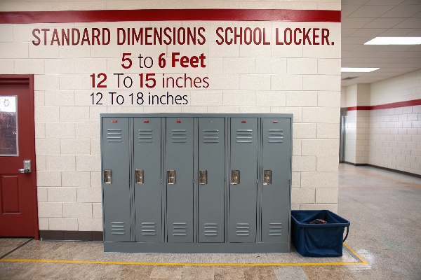 School lockers with standard dimensions displayed above them