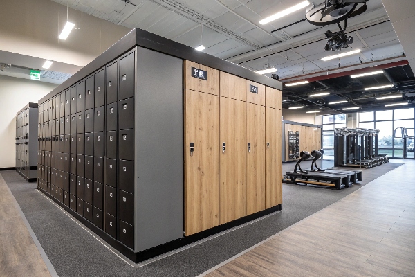 Modern gym lockers with black and wood panel design